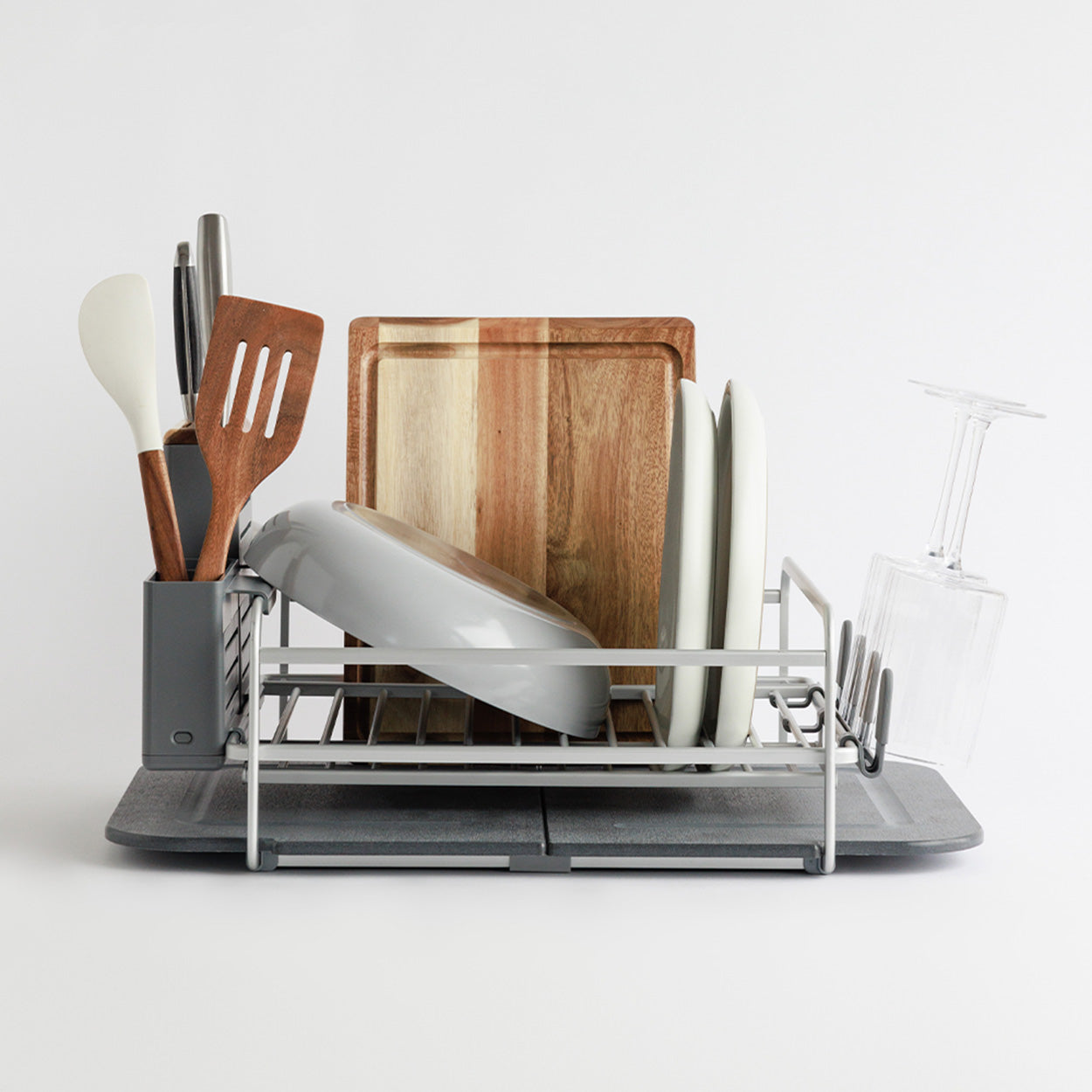 slate dish rack with dishes, cutting board and utensil holder