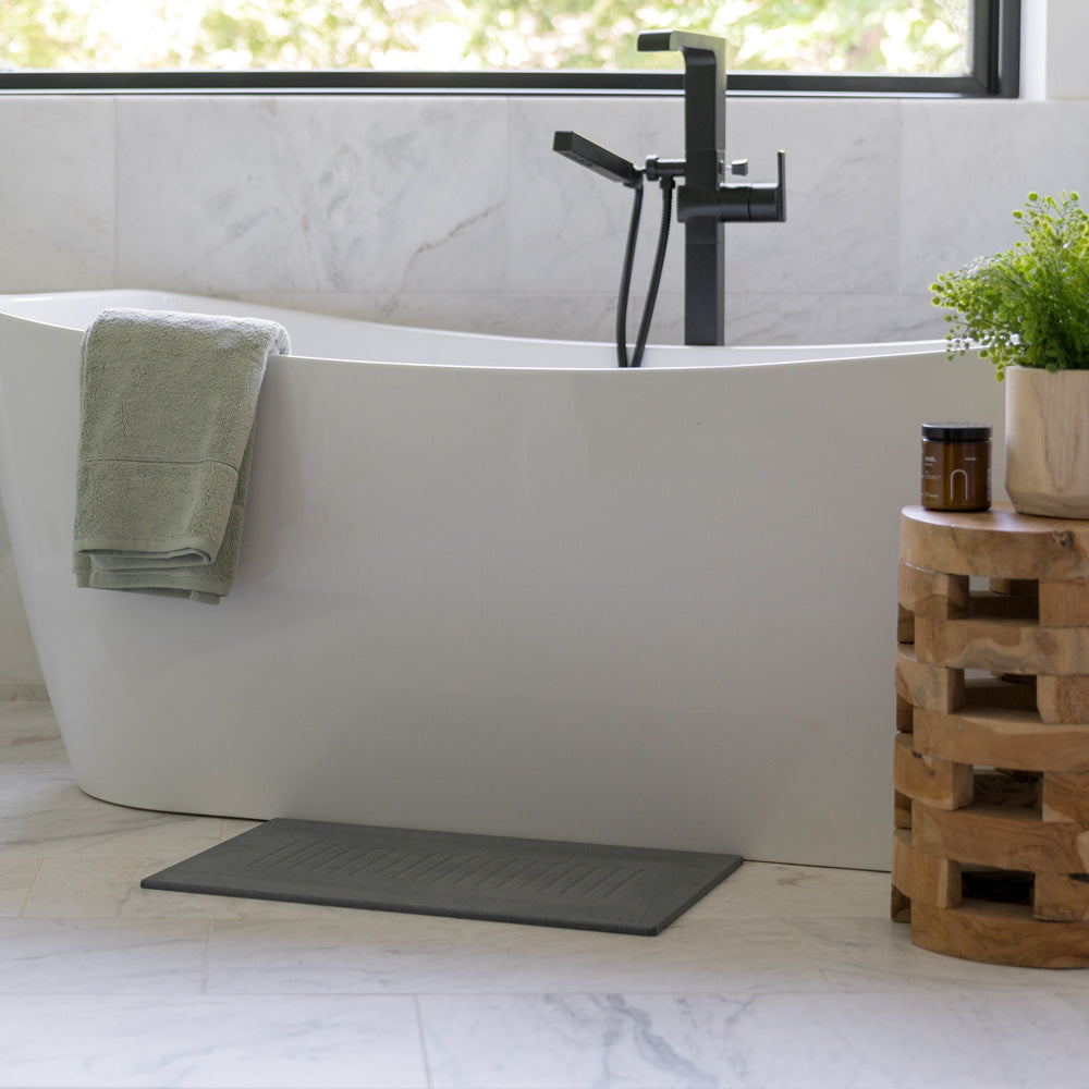 bathroom with tub and slate aspen bath stone
