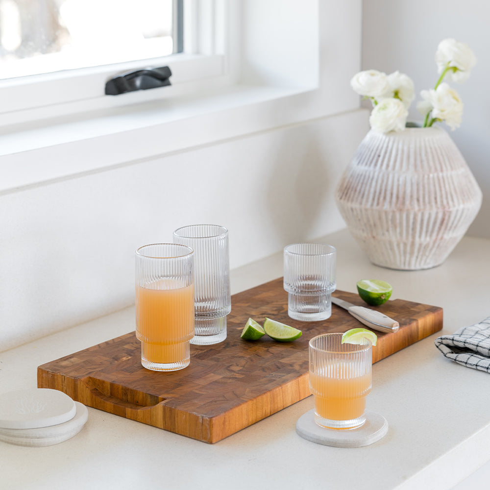 4 pack of modern coasters being used for drinks