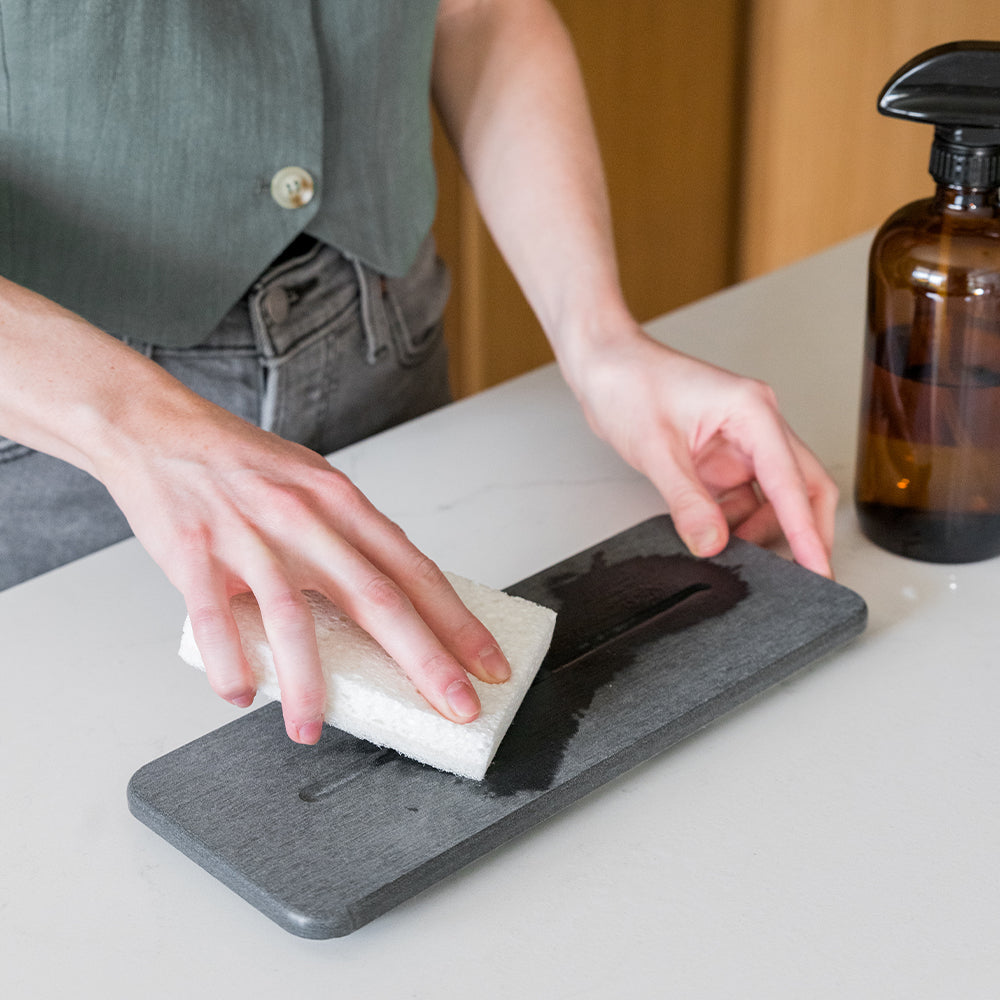 stone sink caddy being cleaned to restore its quick-drying functionality