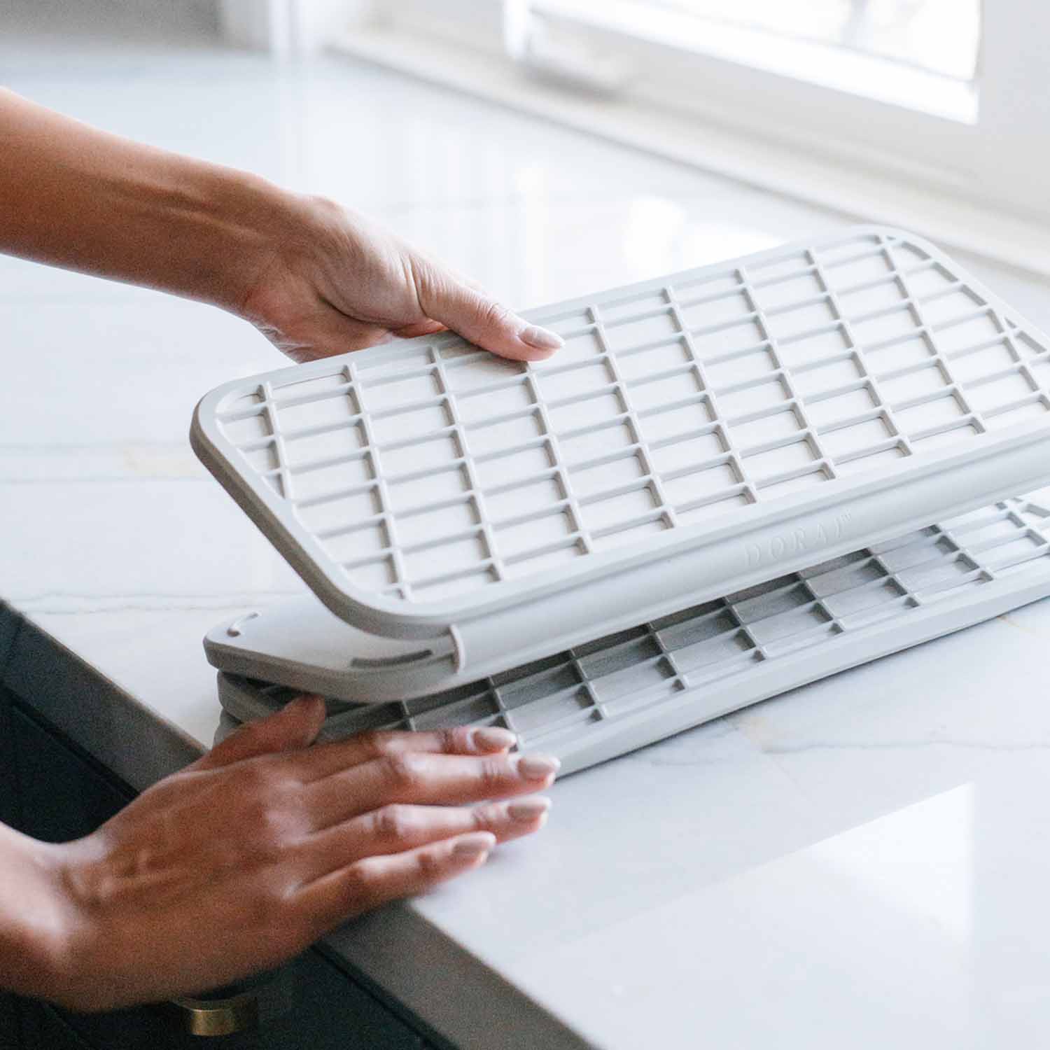 white dish pad being folded for easy storage