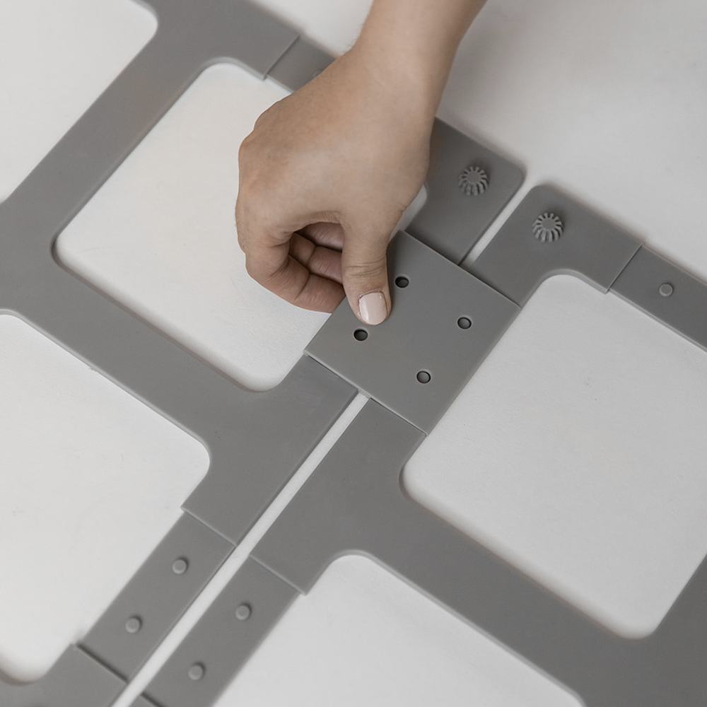 plastic clip being placed onto silicone base of the bath stone