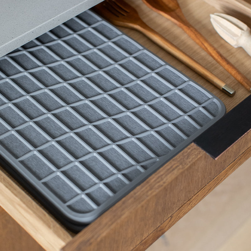 slate dish pad with silicone in drawer being stored