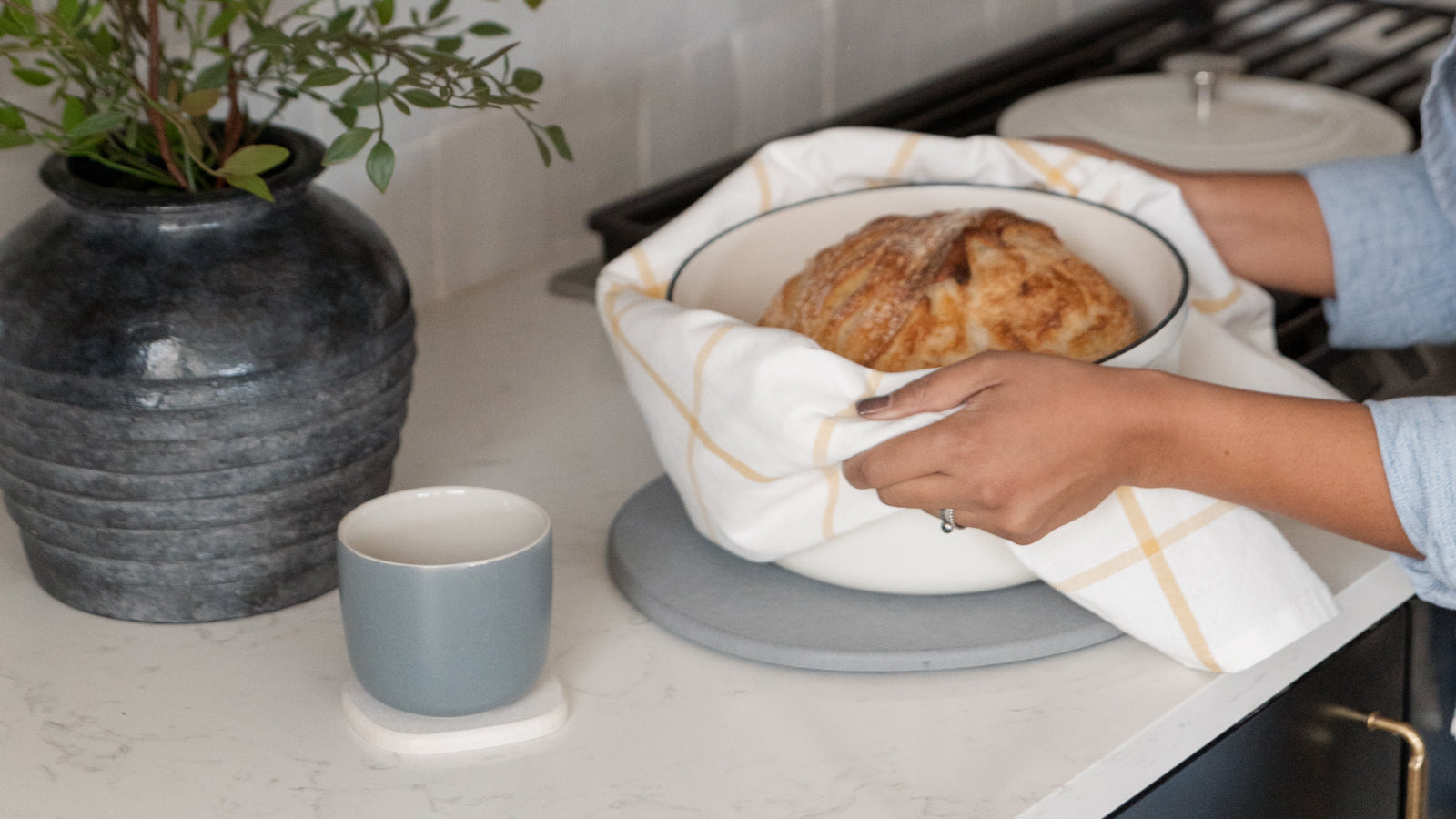 dutch oven with bread on top of trivet