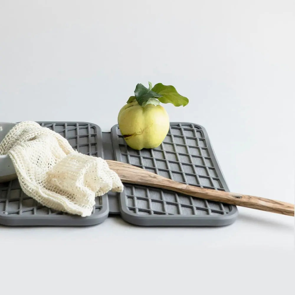 Slate Dish pad with wooden spoon and fruit on it