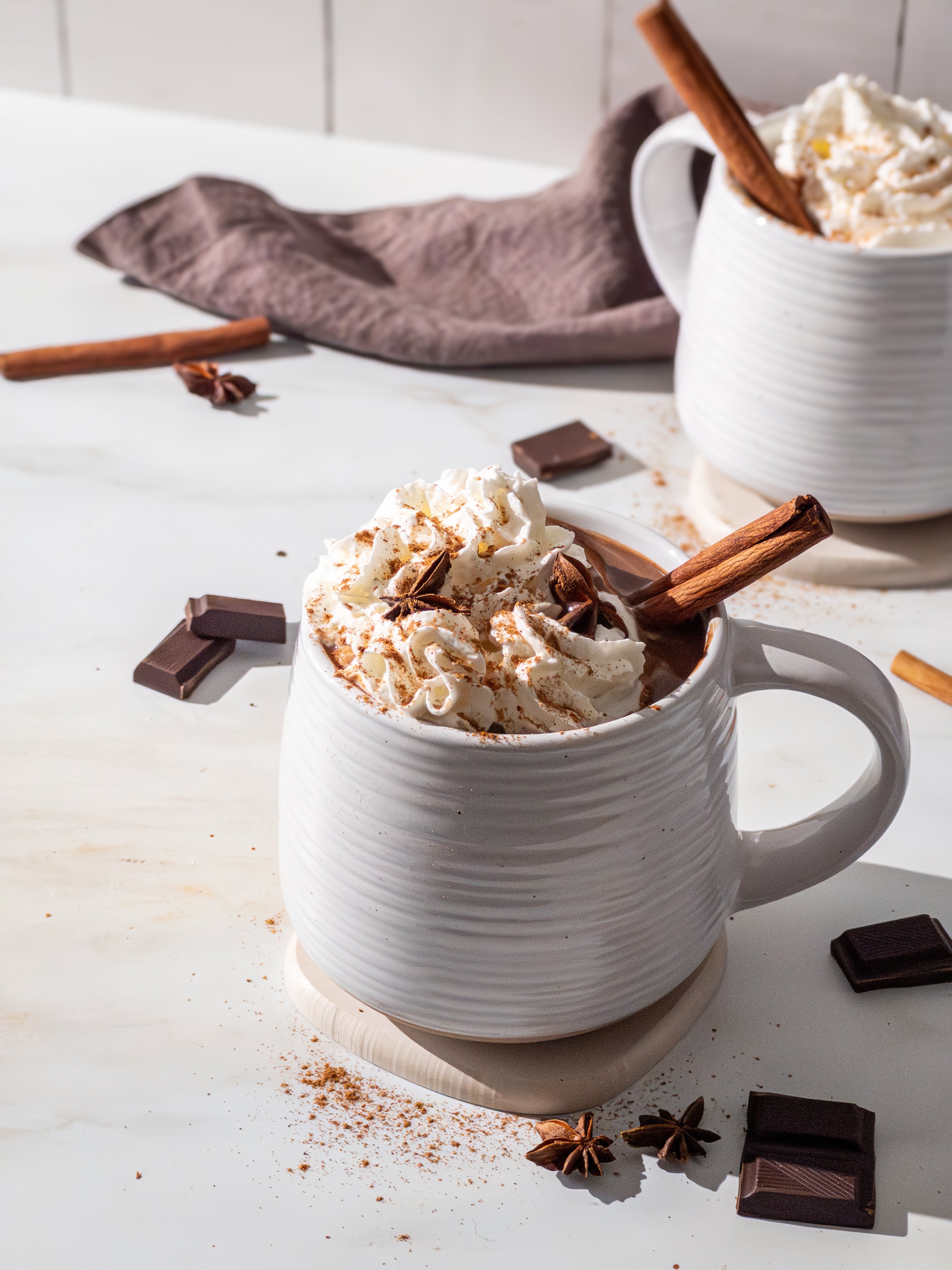 hot chocolate in mug on top of a coaster