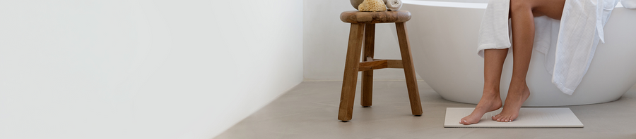 person stepping on large bath stone 
