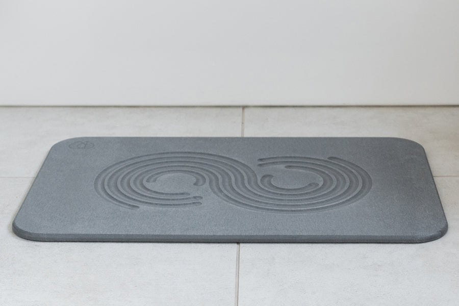 Dorai Bath Stone in Slate color, featuring a Zen design, placed in a bathroom setting.