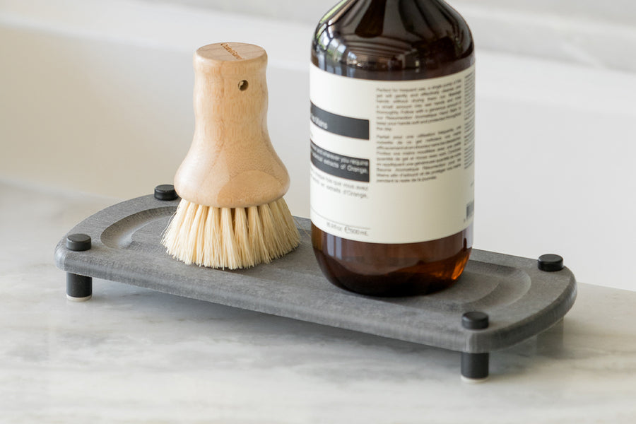 Dorai Sink Caddy in Slate color, organized with dishwashing accessories on a kitchen counter.