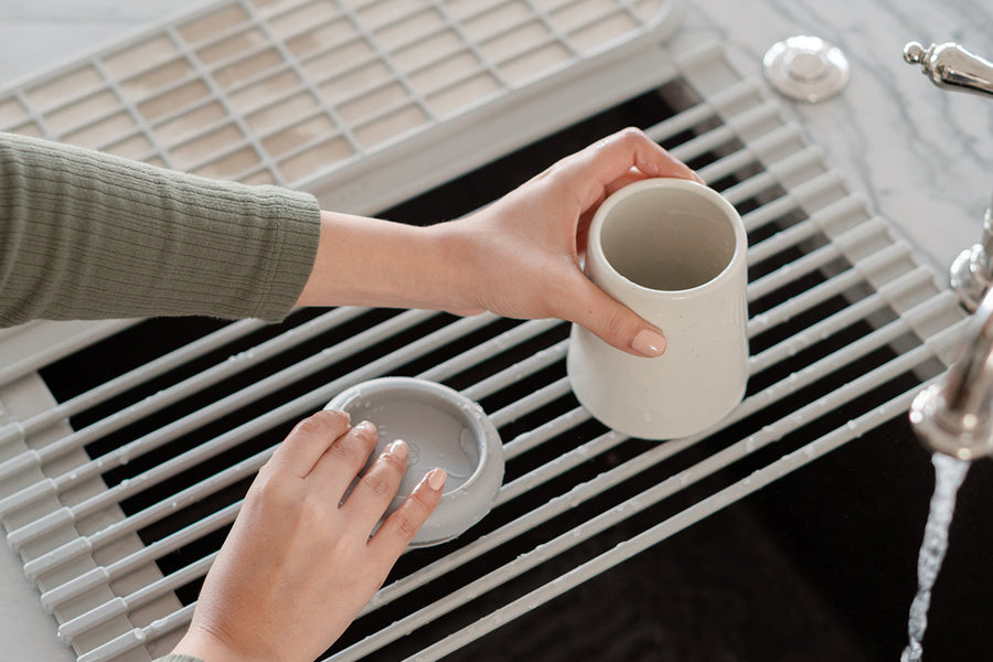 Dishwasher-safe ceramic cup and silicone base.