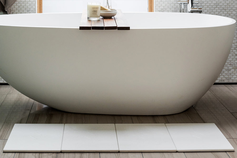 Dorai large Bath Stone in Sandstone color, featured in a bathroom, highlighting its practical design.