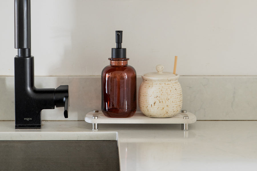 Dorai Sink Caddy in Sandstone color, shown on a kitchen counter, holding dishwashing essentials.