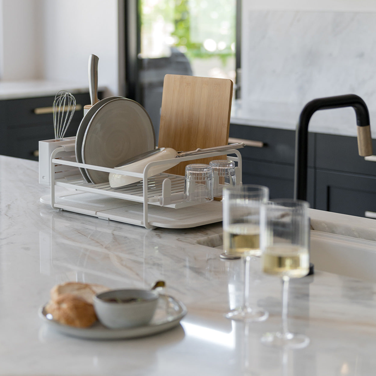 kitchen counter with dish rack and dishes