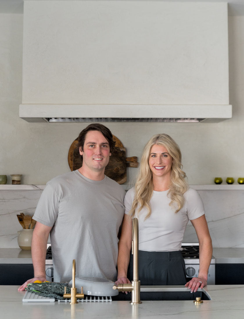 Founders Kelsey and Jason in a modern kitchen with quick-drying Dorai products. 