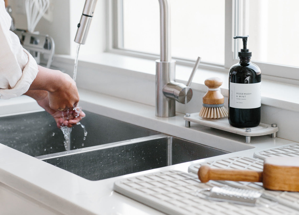 kitchen sink with sink caddy and dish pad