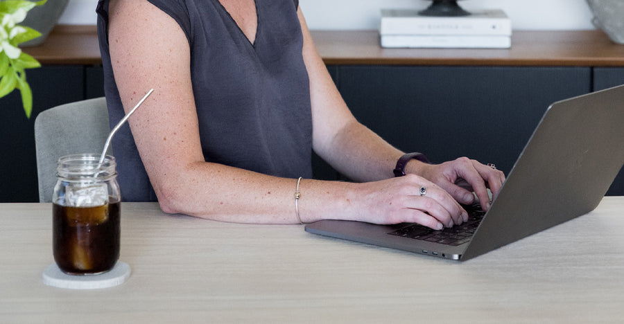 person in office with laptop