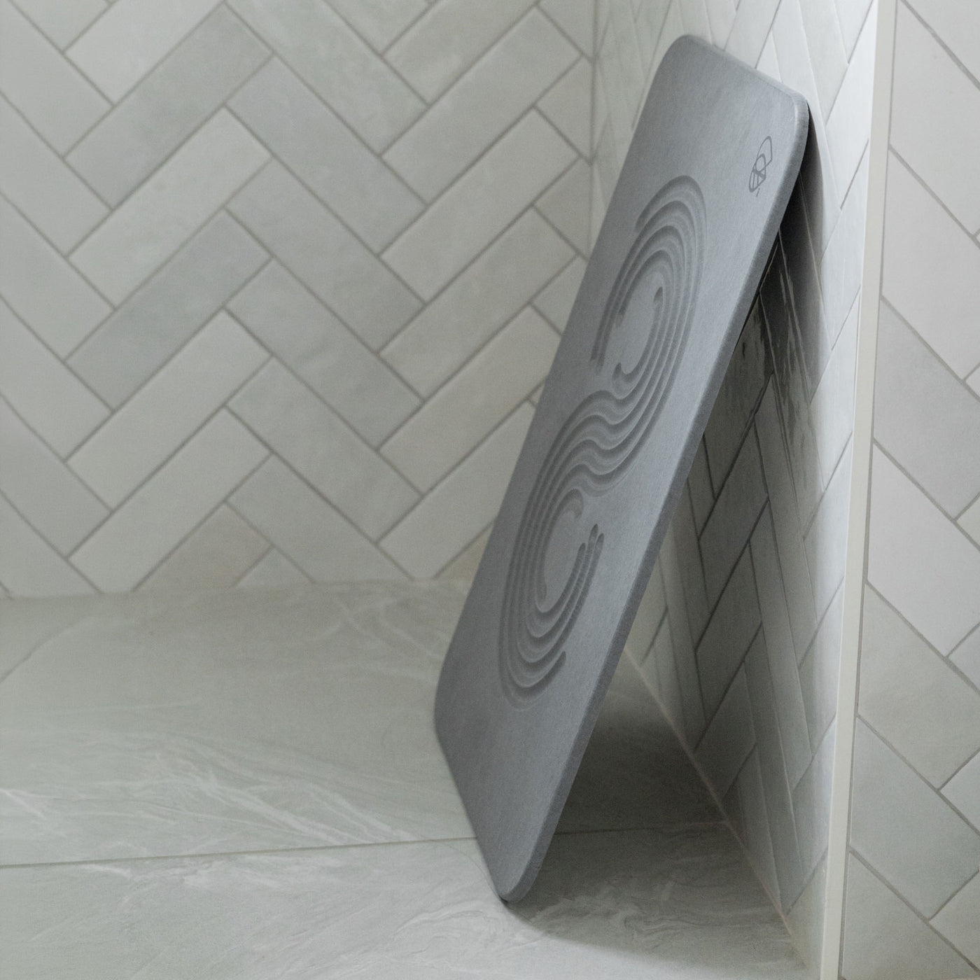 Original bath stone in Slate leaned against wall in front of shower
