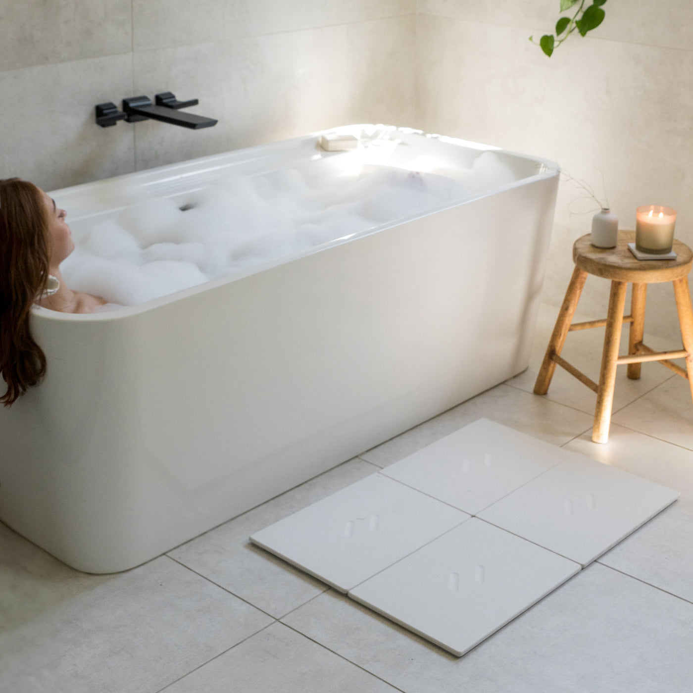 Large Alta bath stone mat in Sandstone for quick-drying mat outside large free-standing tub.