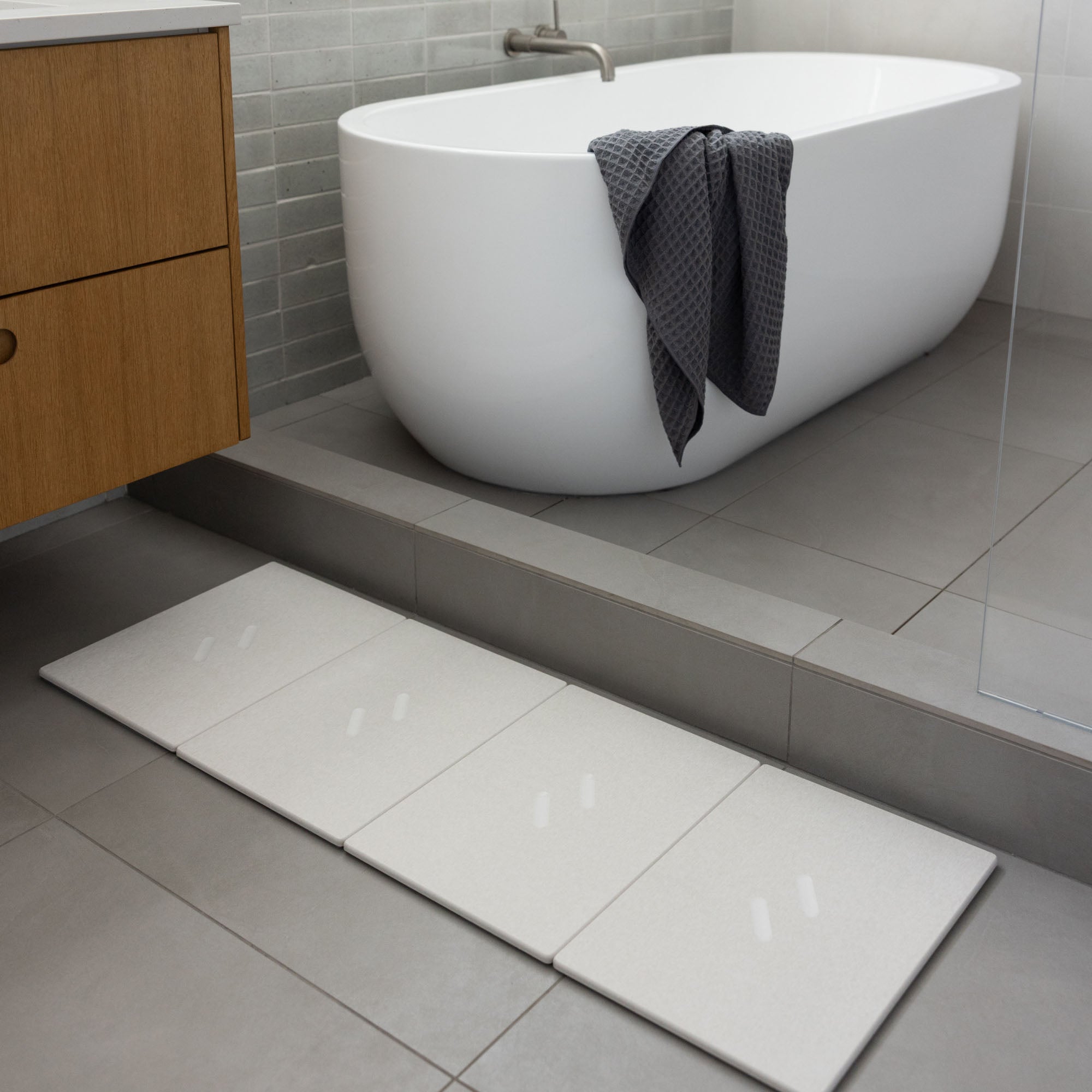 Large Alta Bath Stone in Sandstone stretched layout in modern bathroom.
