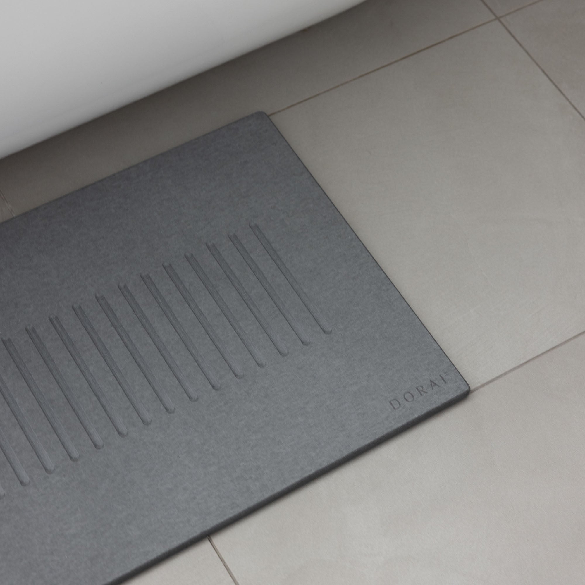 Original bath stone in Slate in front of free-standing tub in modern bathroom