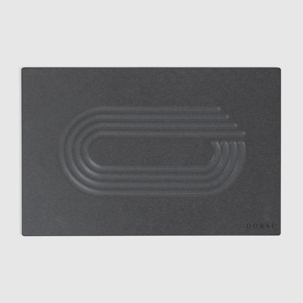 Dark gray modern quick drying stone with embossed design on a light gray background