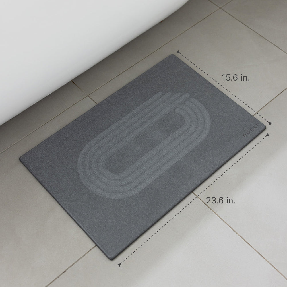 Gray mat with dimensions on a tiled floor