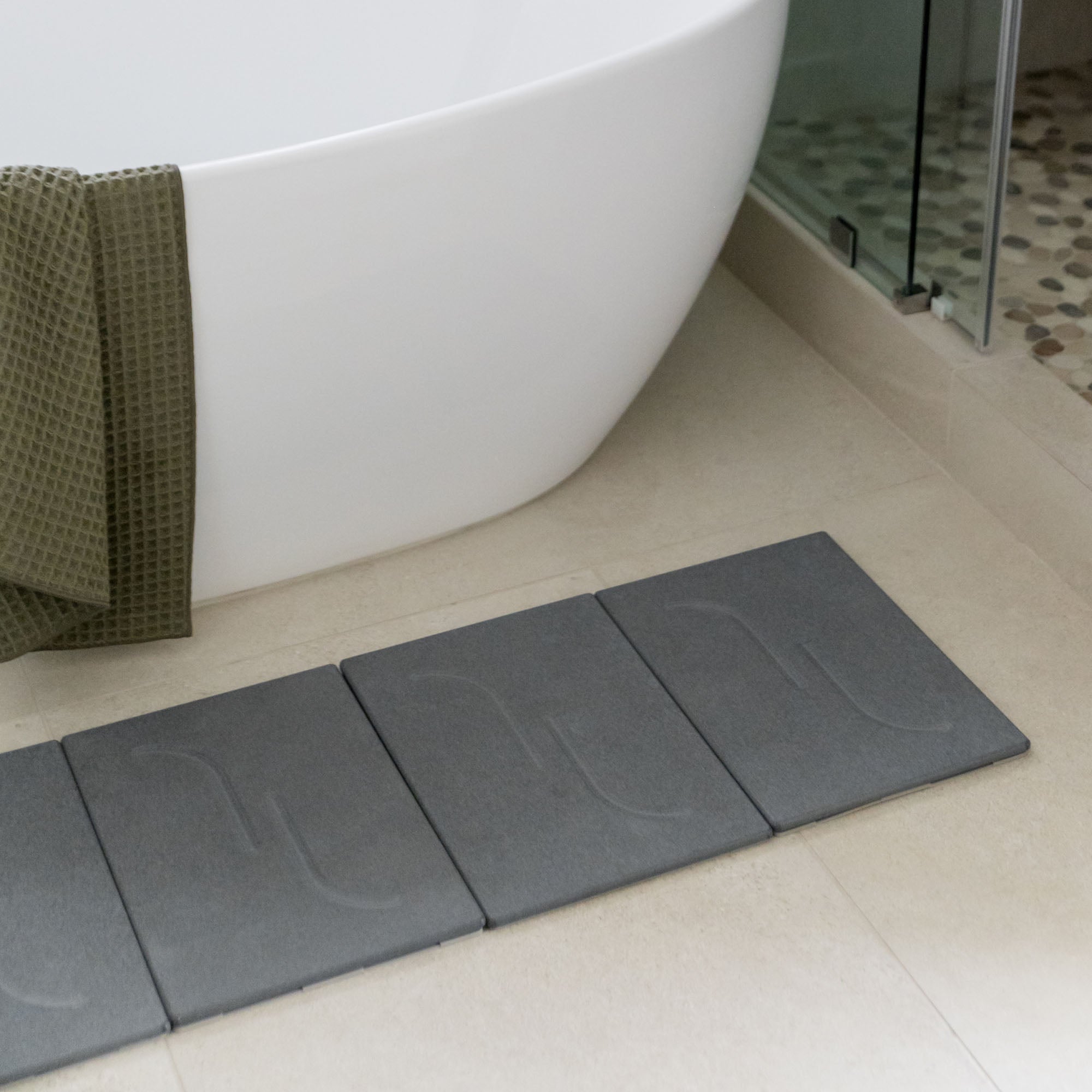Large Arch Bath Stone in Slate stretched layout in modern bathroom.