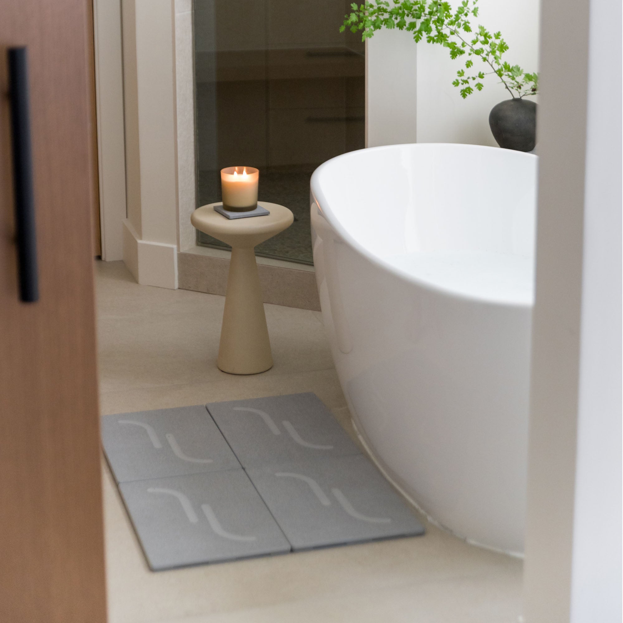 Large Arch Bath Stone in Ash in modern bathroom.
