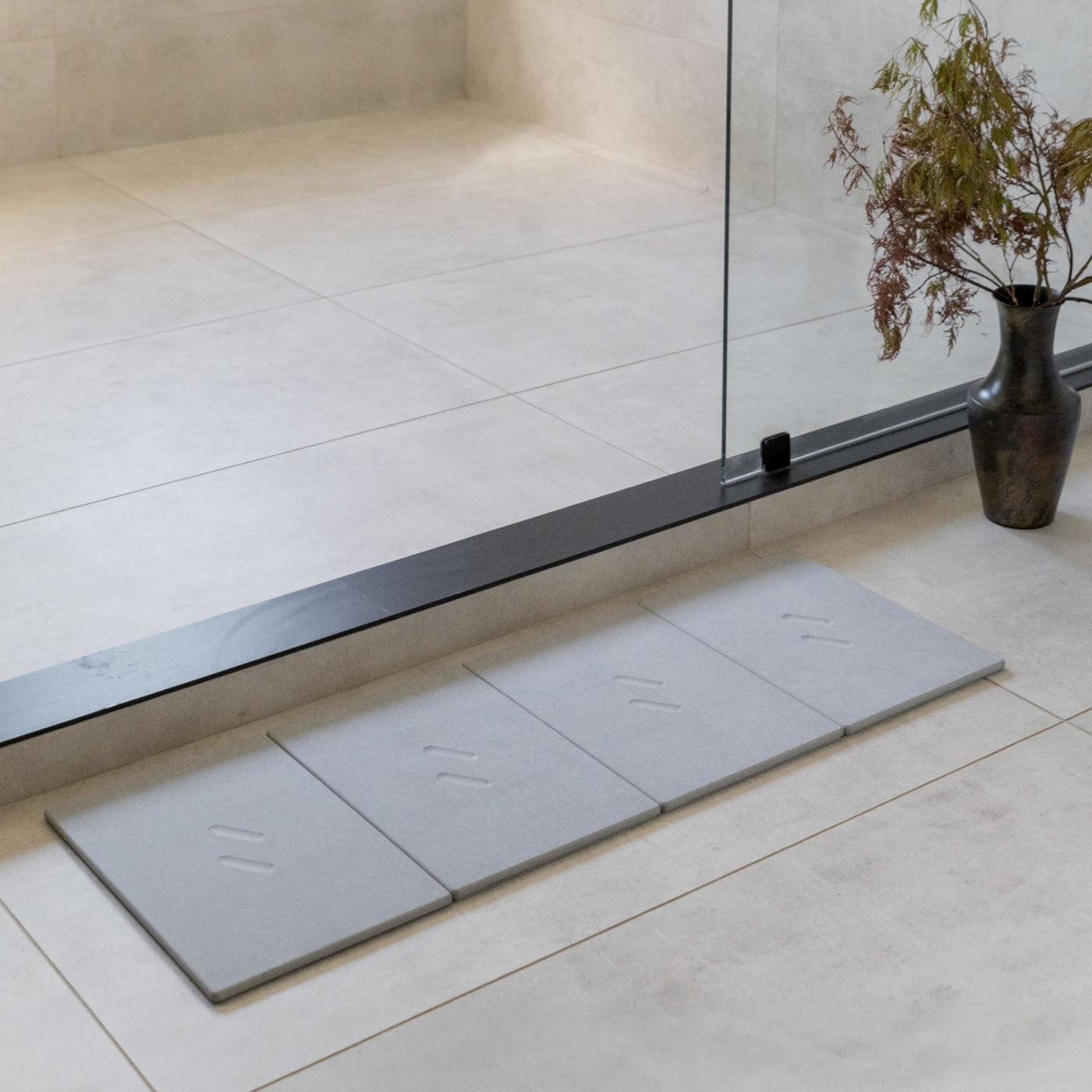 Large Alta Bath Stone in Ash stretched layout in modern bathroom.
