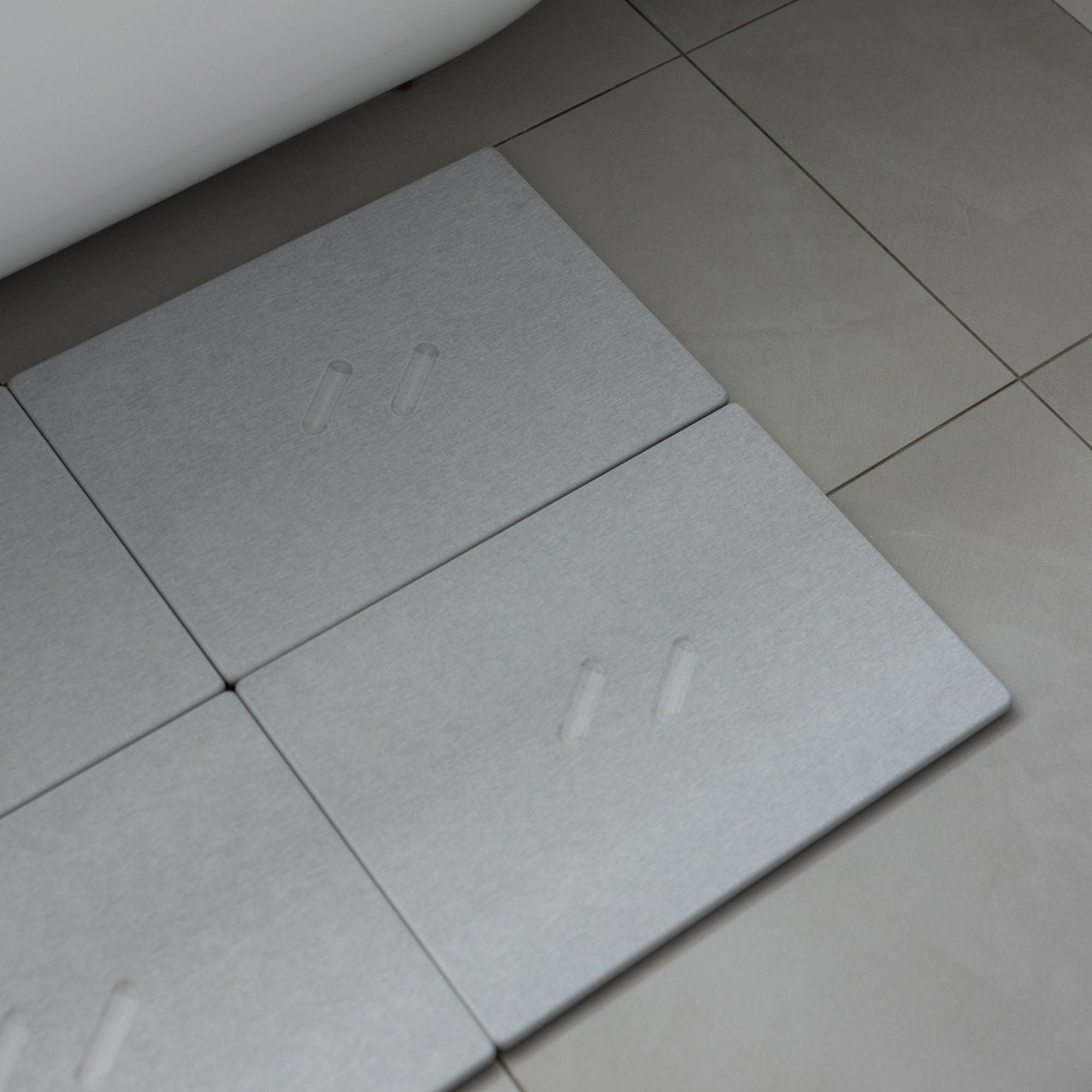 Large Alta bath stone mate in Ash for quick-drying outside large free-standing tub.