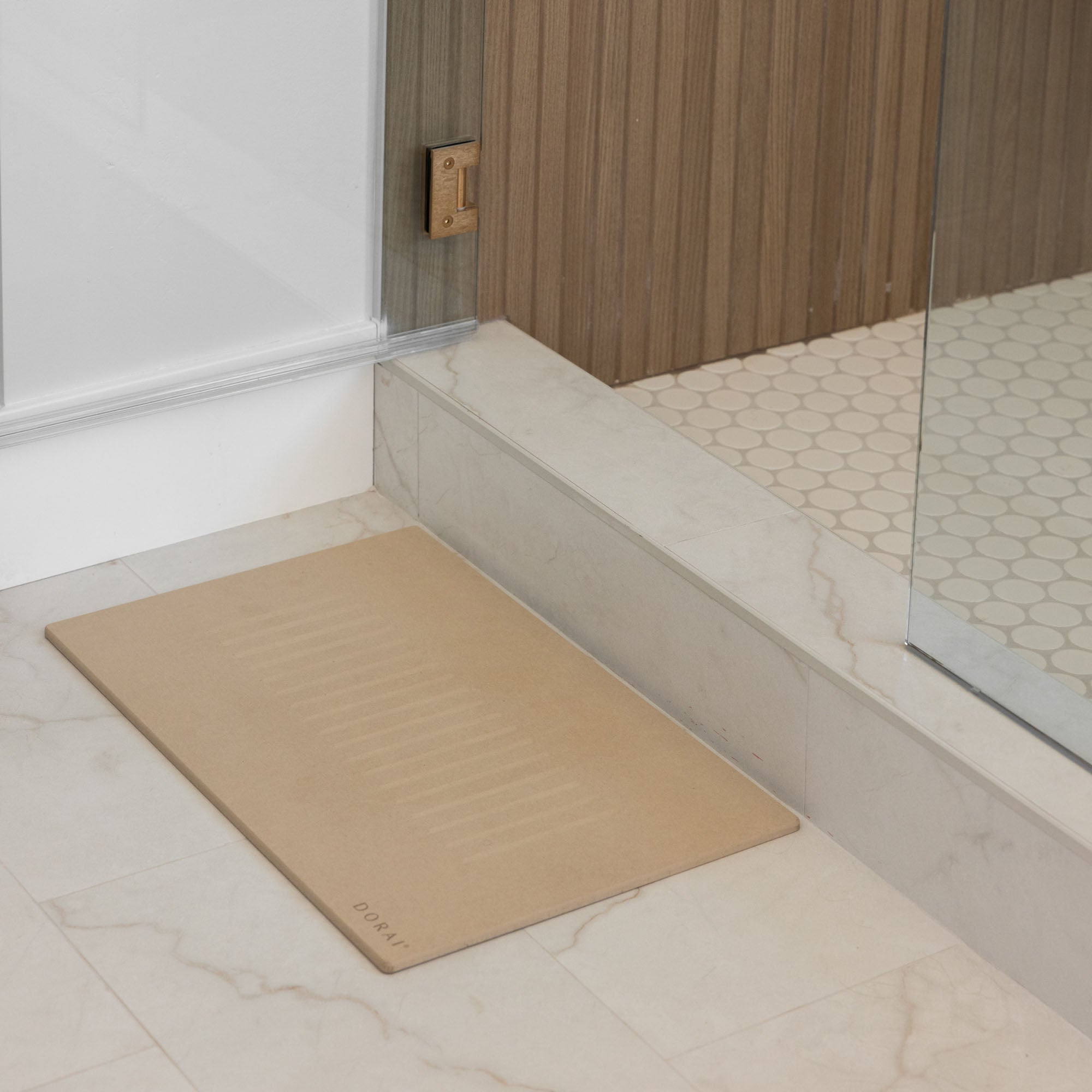 Aspen Clay Bath Stone Mat in front of beautiful shower. 