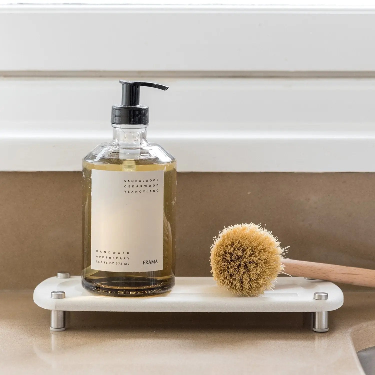 Soap and brush on sink caddy