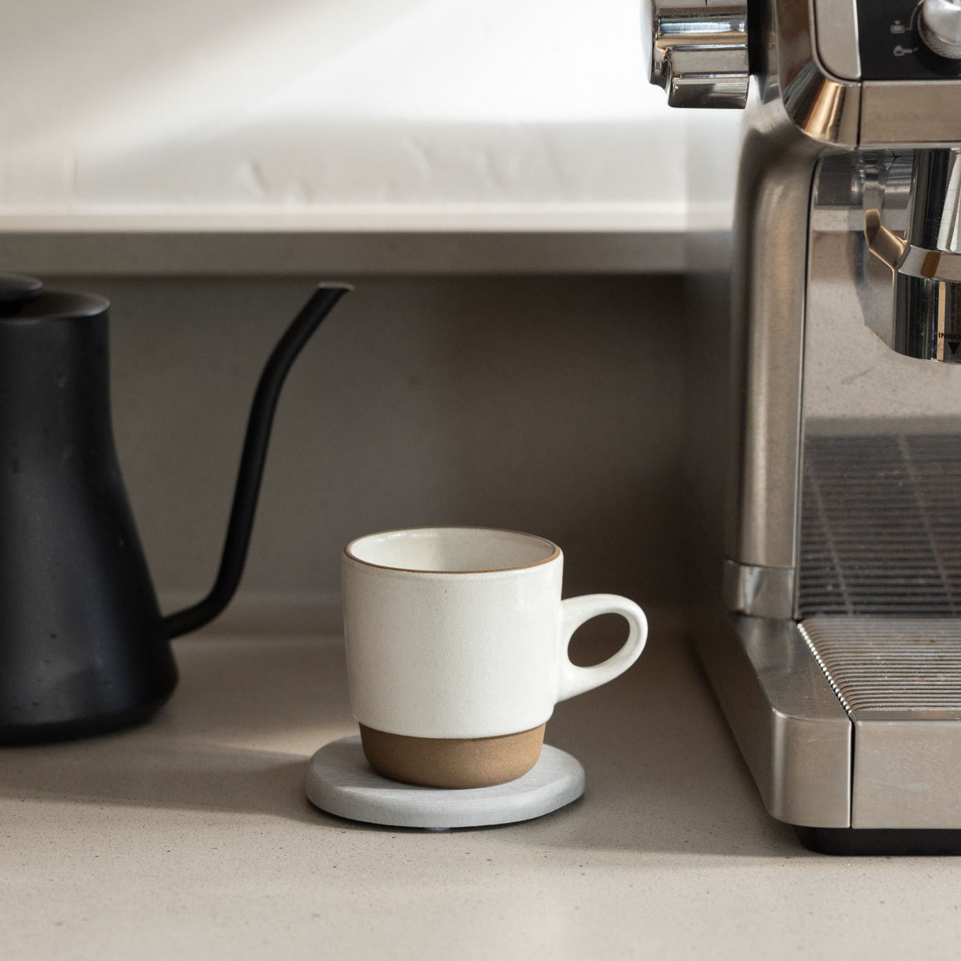 Modern Ash Stone Coaster with coffee mug.