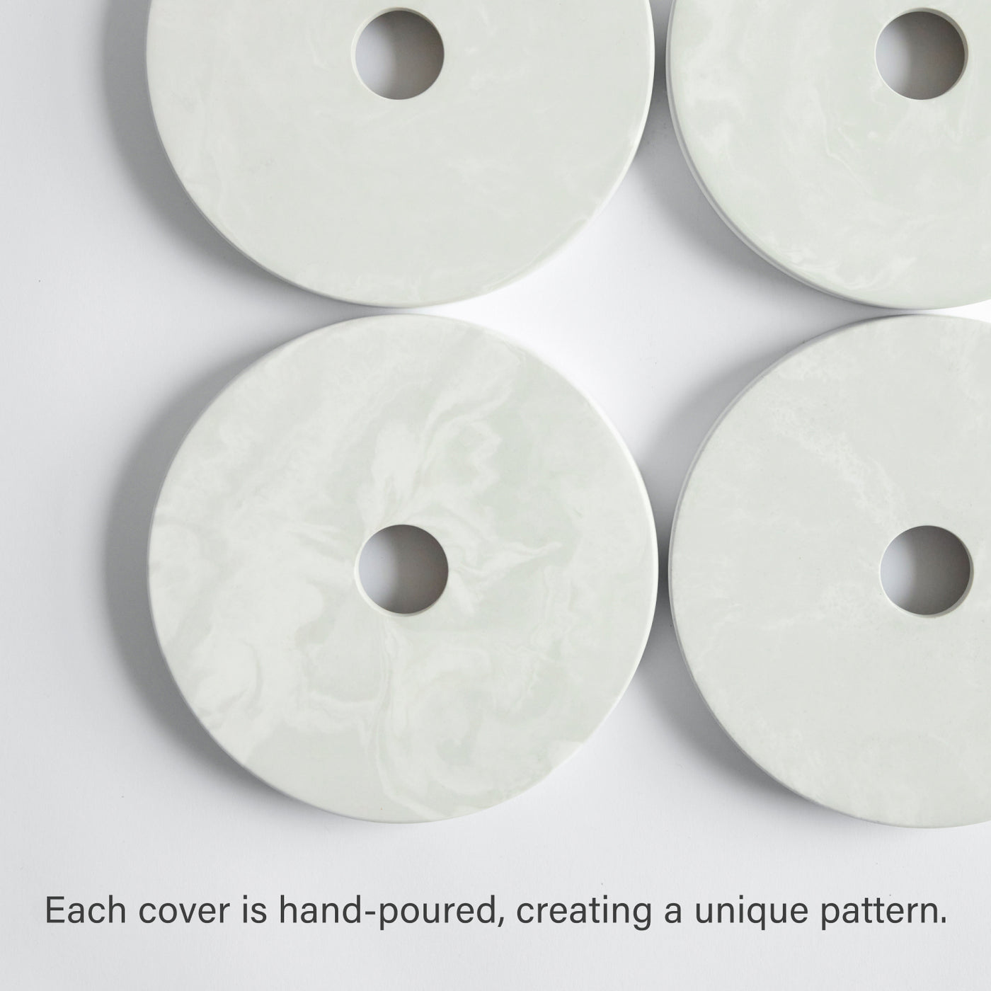 Four paper towel covers; hand poured, creating a unique pattern. 