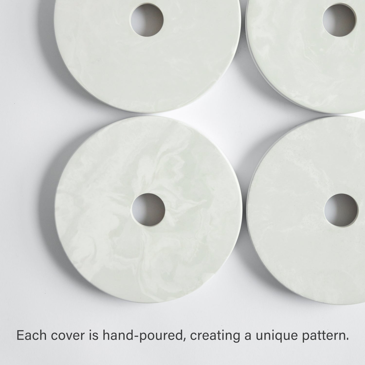 Four paper towel covers; hand poured, creating a unique pattern. 
