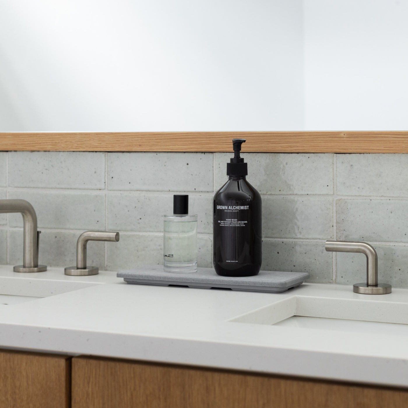 bathroom countertop with sink organizer and lotions