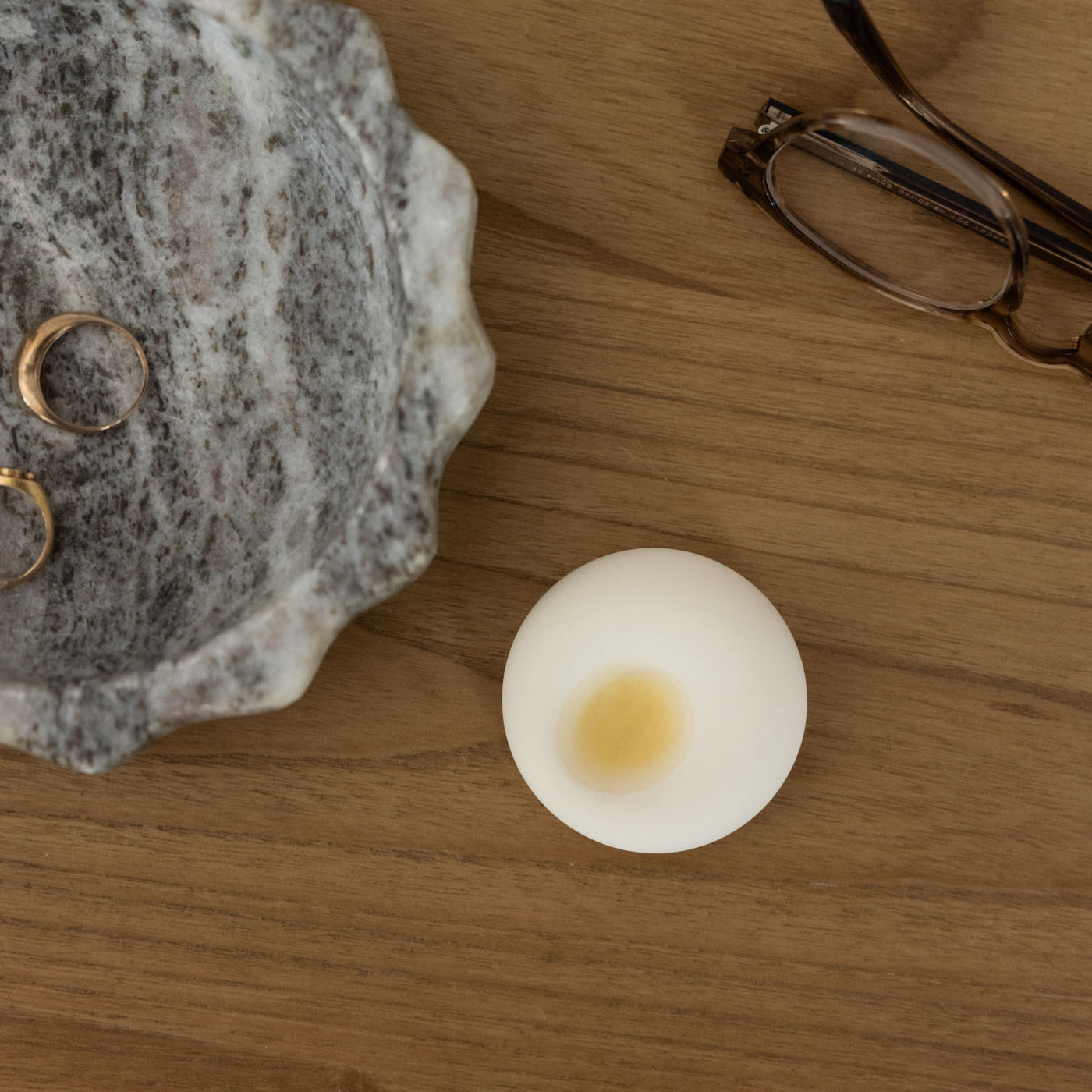 scent diffuser stone on desk with oil drops