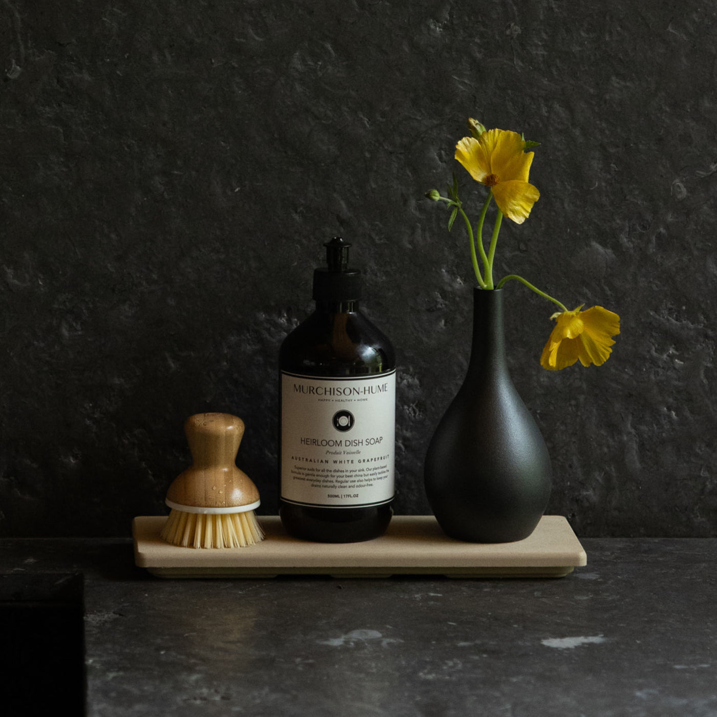 Clay Stone Sink Caddy in modern kitchen with soap and bud vase.