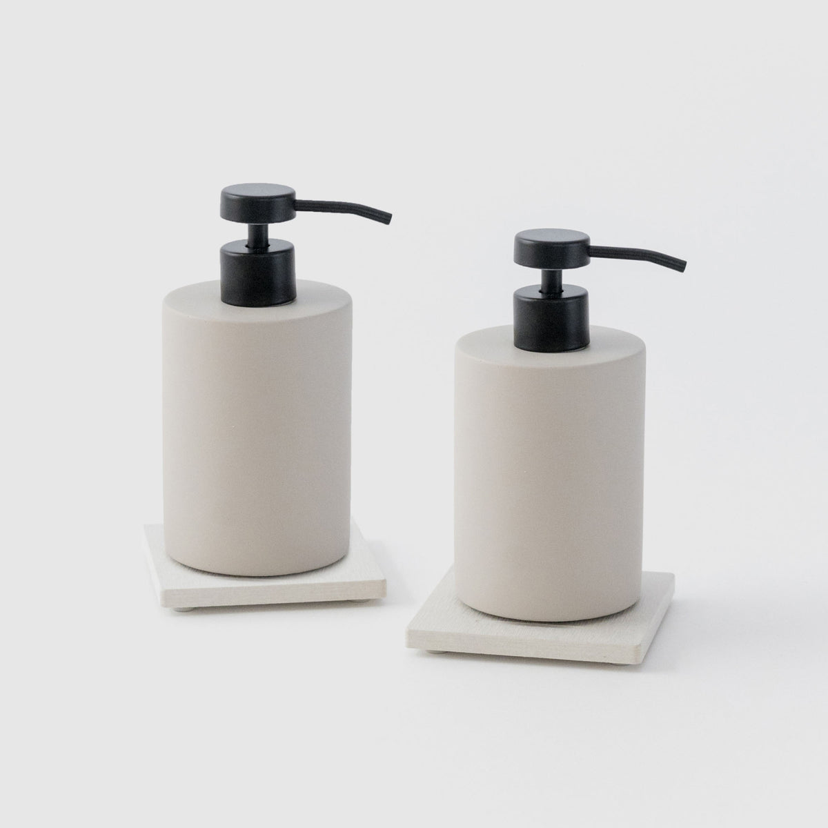 Two Sandstone Soap Caddy with Concrete Soap Dispensers on white background. 