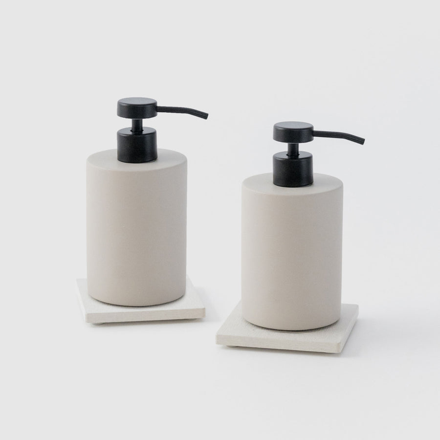 Two Sandstone Soap Caddy with Concrete Soap Dispensers on white background. 