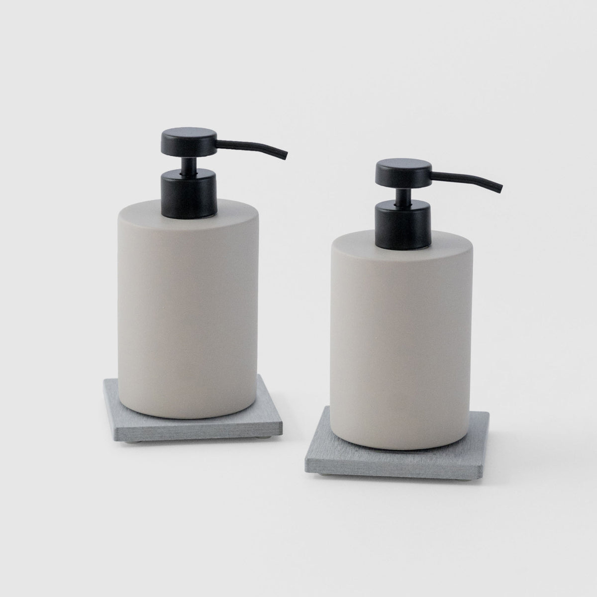 Two Ash Soap Caddy with Concrete Soap Dispensers on white background. 