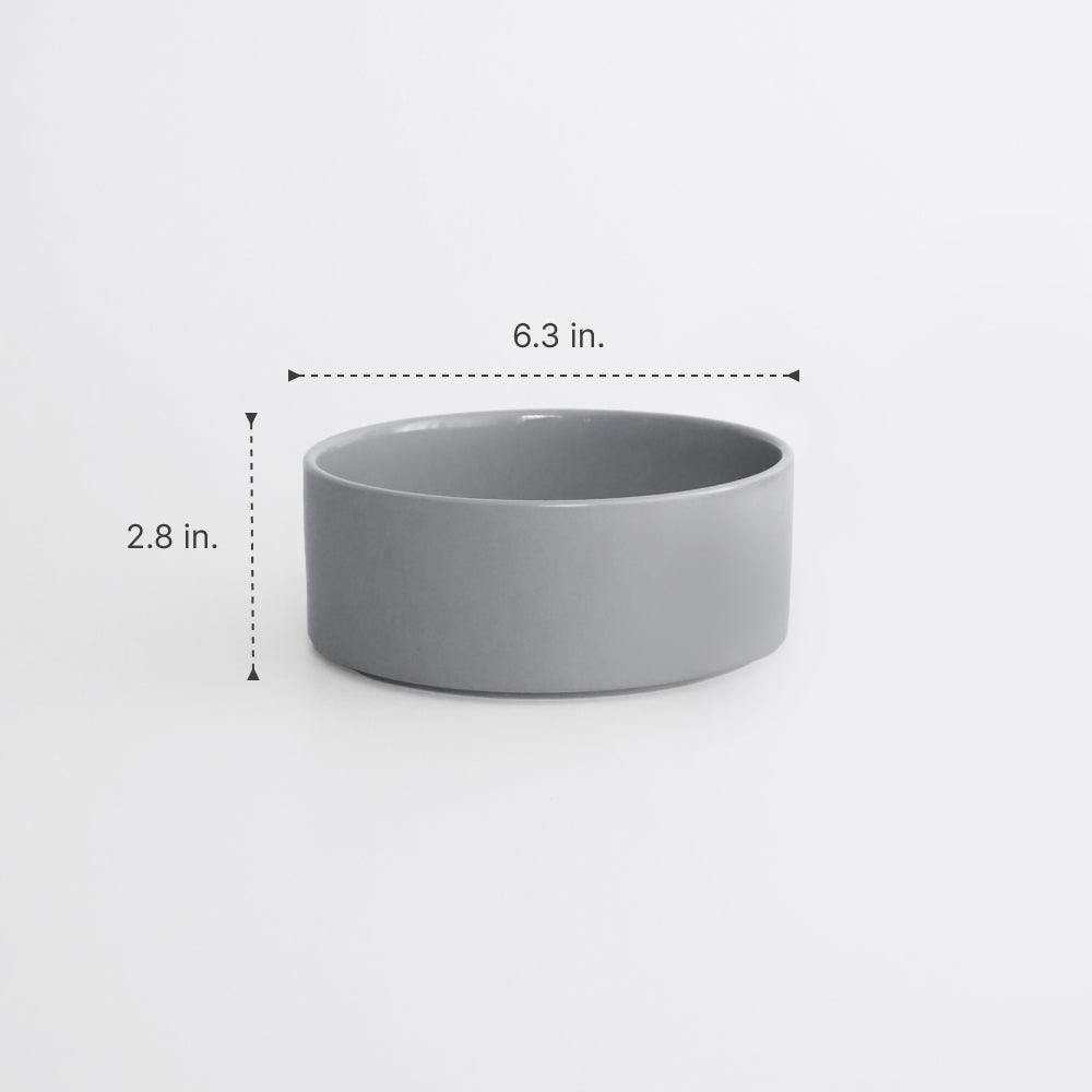 Gray ceramic bowl with dimensions labeled on a white background
