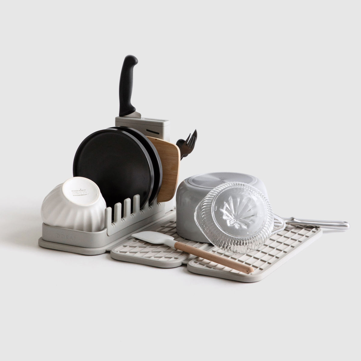 Sandstone Dish Pad with Sandstone Dish Pad Rack on white background with dishes. 