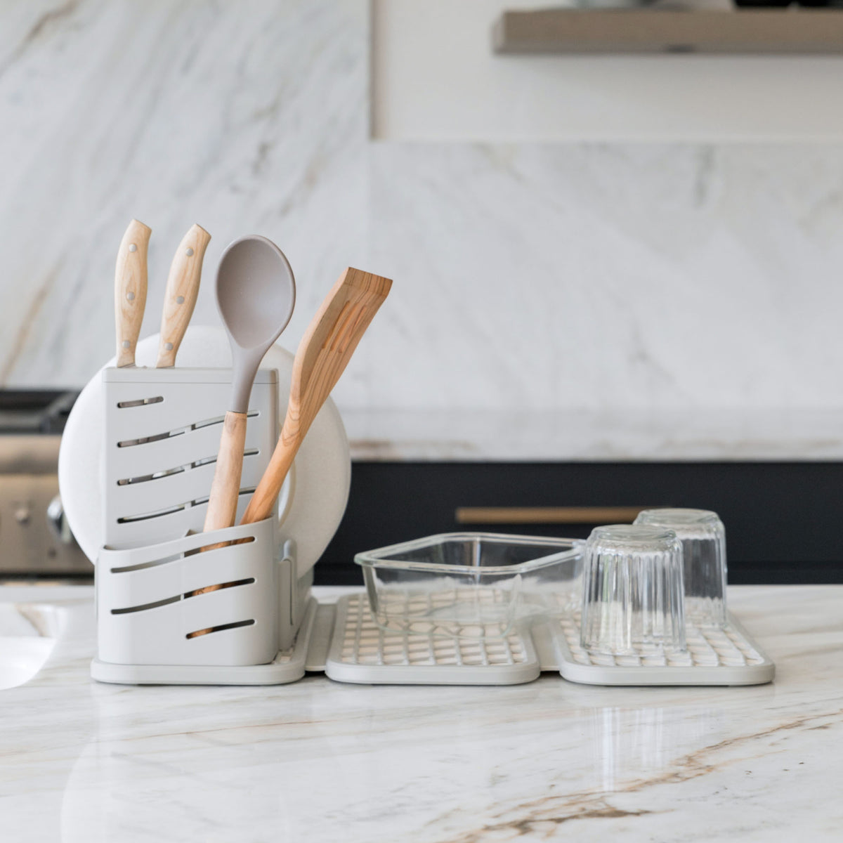 Sandstone Dish Pad with Sandstone Dish Pad Rack in clean kitchen with dry dishes. 