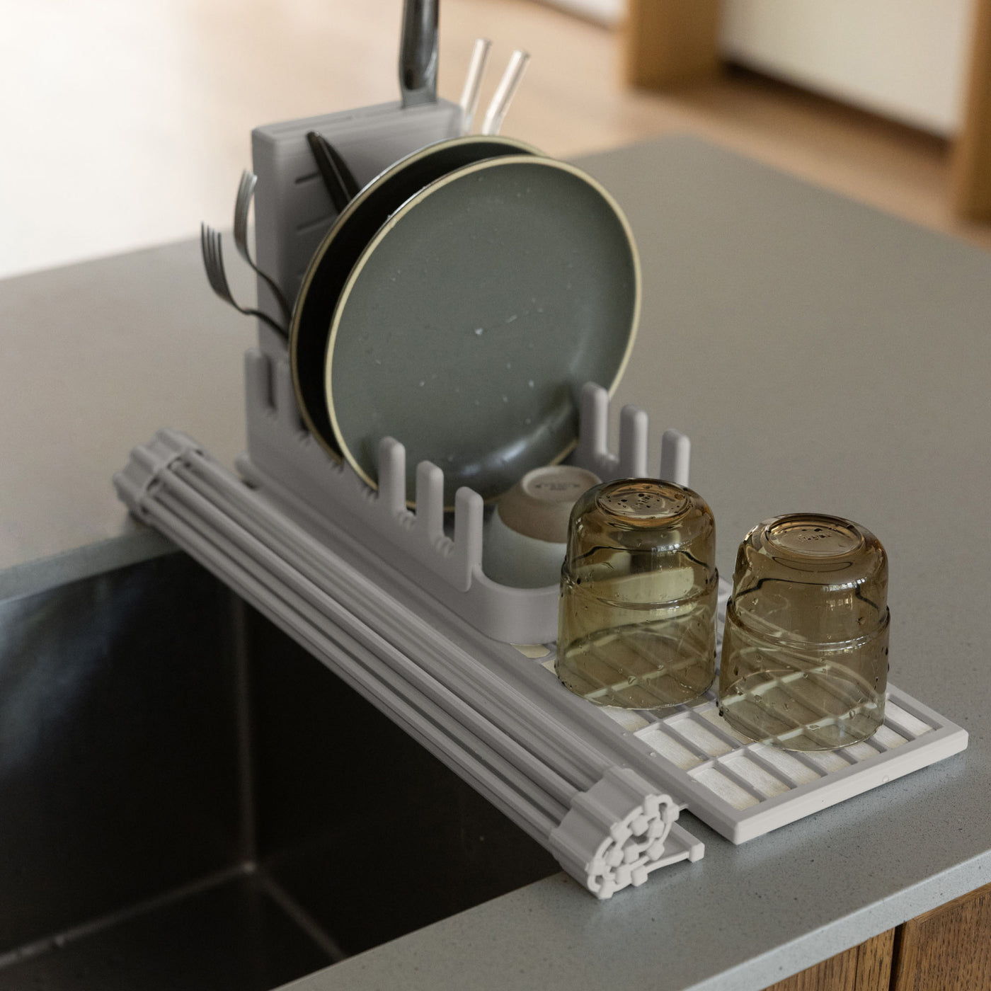 Sandstone Over the Sink Dish Pad with dishes rolled up. 