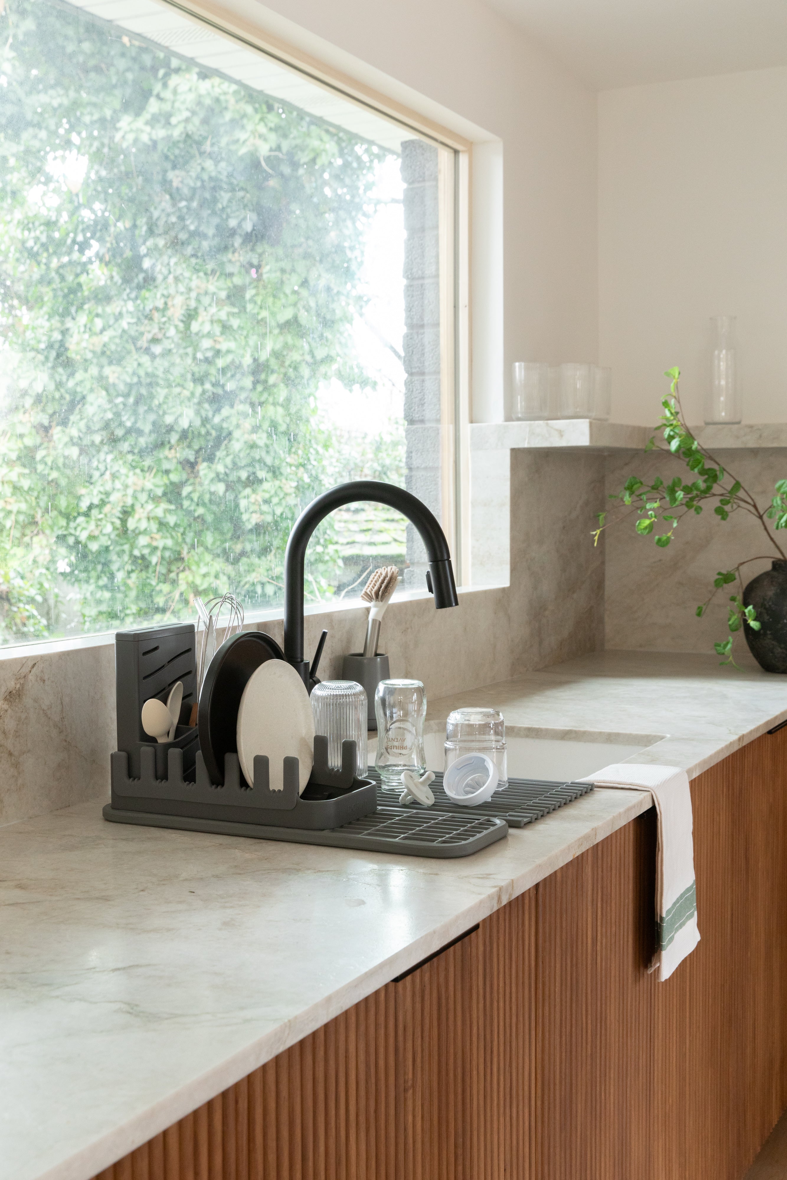 kitchen sink with baby bottle drying station