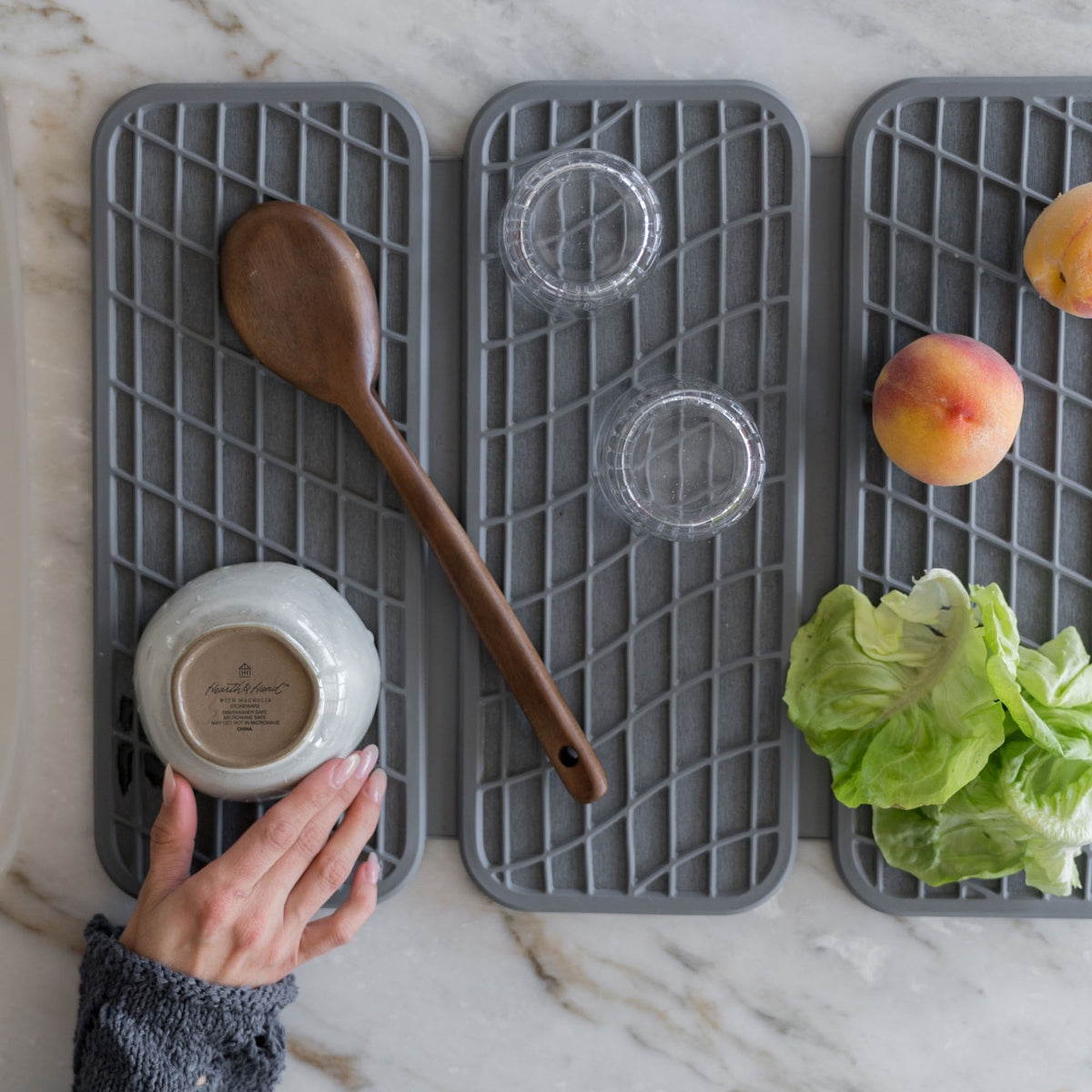 Slate Dish Pad with Slate Dish Pad Rack in clean kitchen with dry dishes and produce. 