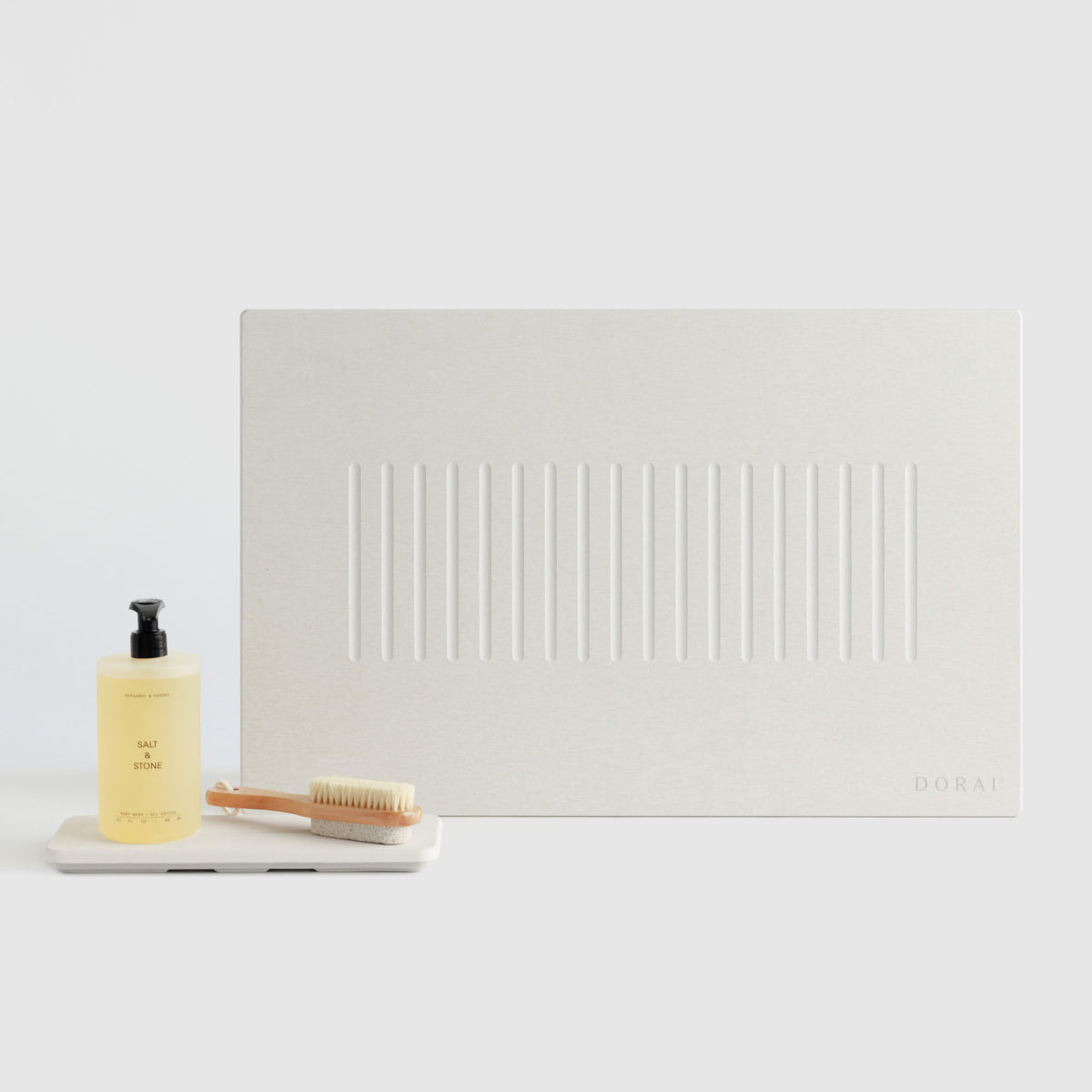 Sandstone Aspen Bath Stone Mat and Sandstone Stone Sink Caddy on white background. 