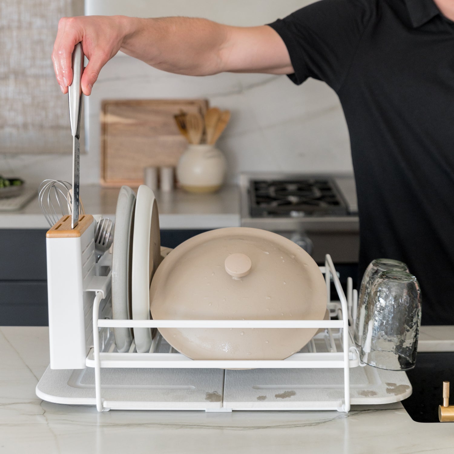 knife being inserted into dish rack