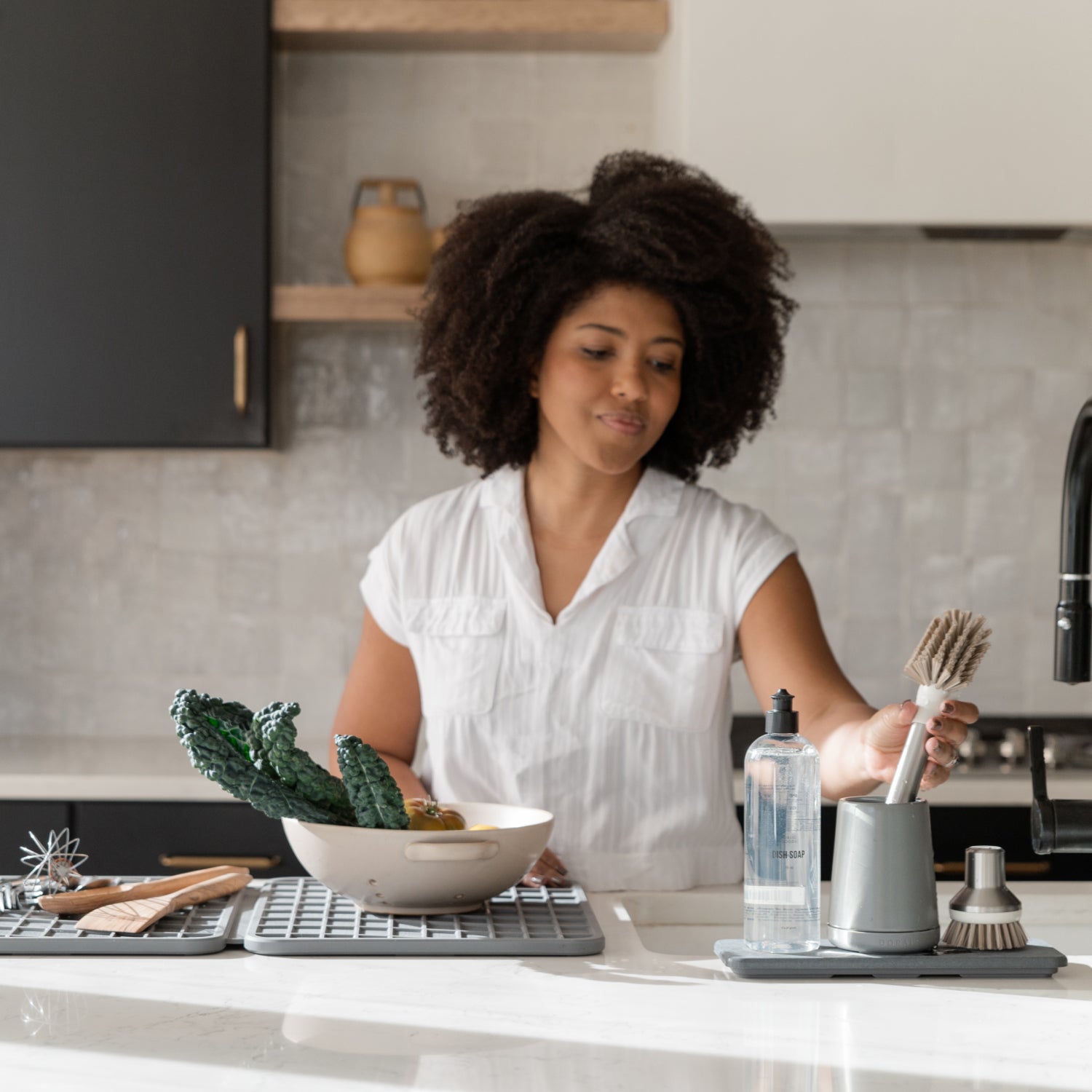 woman using dish brush 